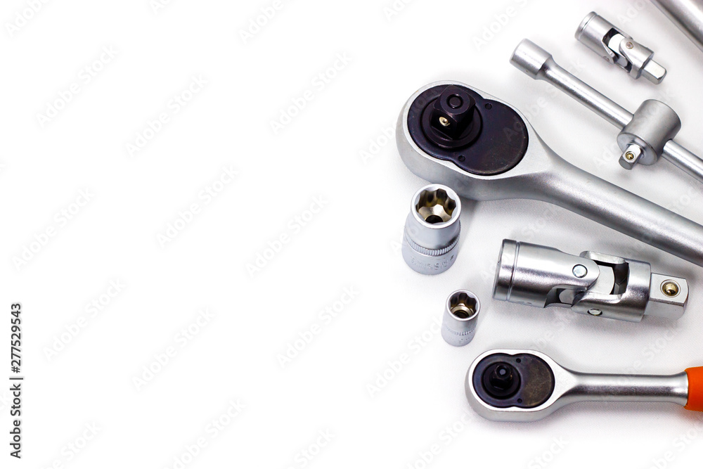 A set of tool heads for loosening screws, bolts and nuts. Ratchet screwdriver. White background - obrazy, fototapety, plakaty 