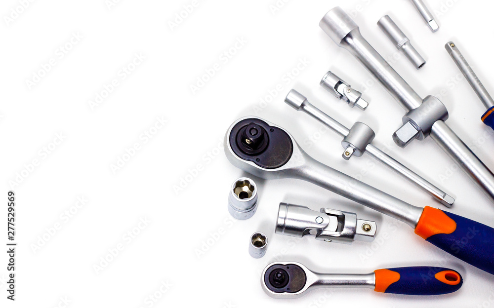 A set of tool heads for loosening screws, bolts and nuts. Ratchet screwdriver. White background A set of tool heads for loosening screws, bolts and nuts. Ratchet screwdriver. White background
