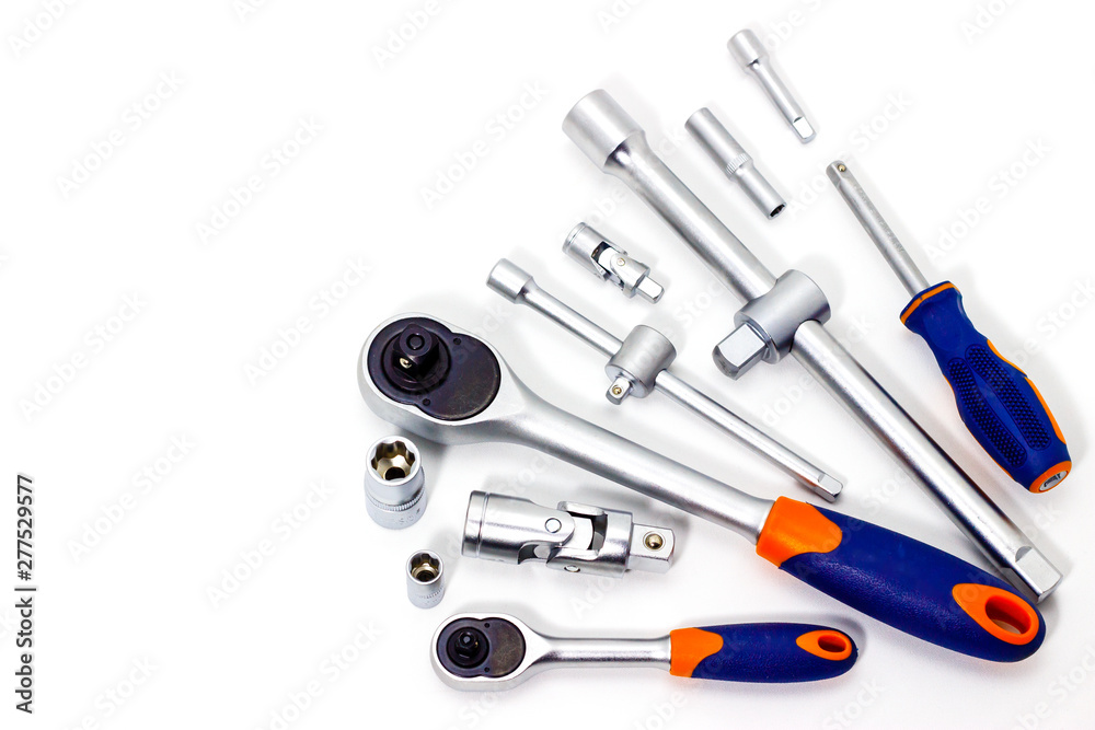 A set of tool heads for loosening screws, bolts and nuts. Ratchet screwdriver. White background A set of tool heads for loosening screws, bolts and nuts. Ratchet screwdriver. White background