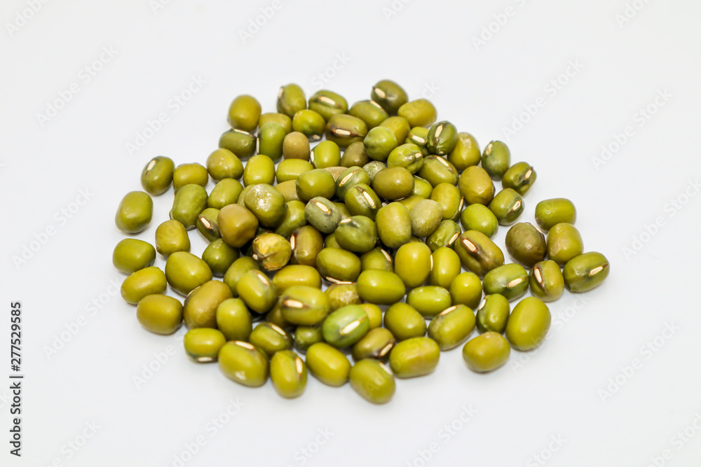Mung bean seeds have long been used as food for humans, green beans, isolated on a white background. Mung bean seeds have long been used as food for humans, green beans, isolated on a white background.