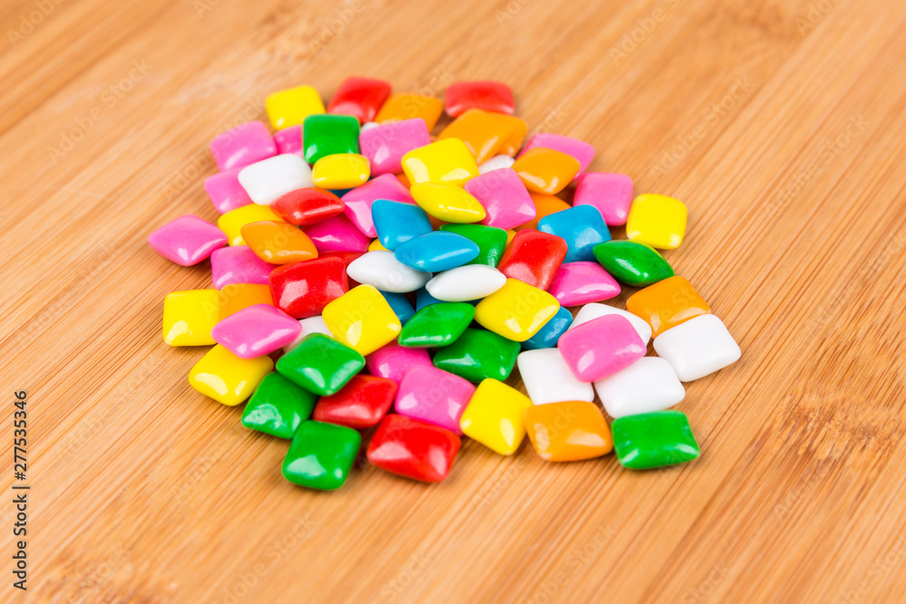 Rounded square unchewed multicolored bubble gum pieces Rounded square unchewed multicolored bubble gum pieces