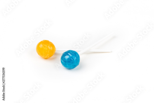 Two colorful candy suckers on sticks
