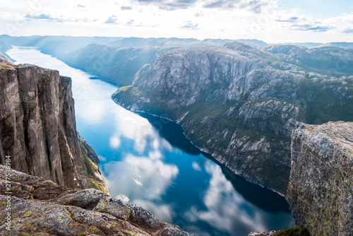 Aerial view of Lysefjorden from Kjeragbolten, with waterfall on the cliff and mountains in background, on the mountain Kjerag in Forsand municipality in Rogaland county, Norway.