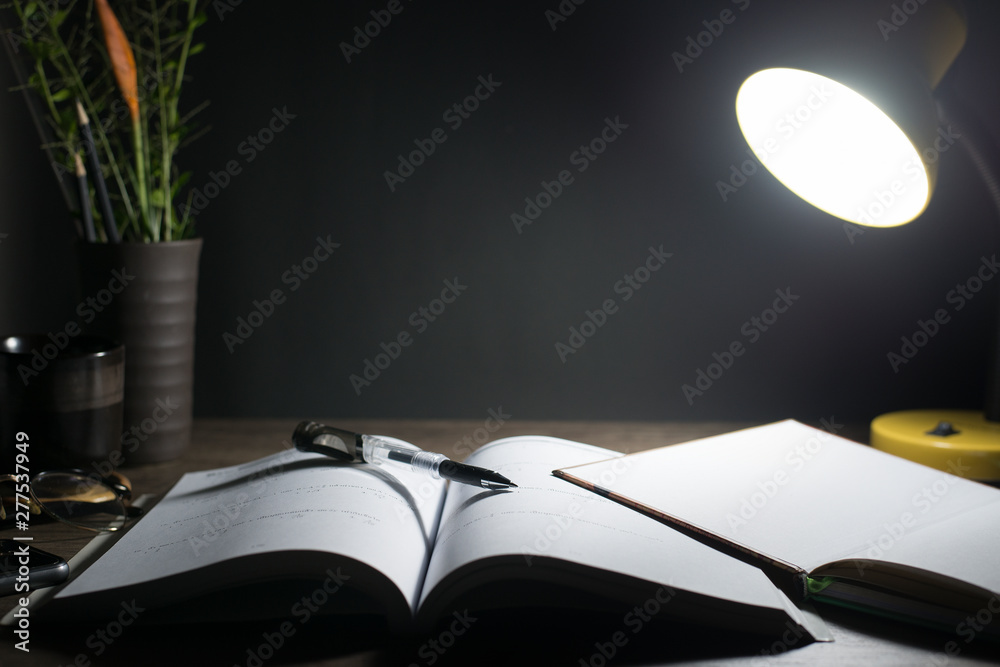 Reading table at night, Open books on the table, Close-up the pen tip,  Copy-space. Stock Photo | Adobe Stock