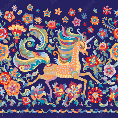 Floral seamless border pattern in folklore tapestry tradition, unicorn print on a dark indigo blue background. Fantasy rose flowers, leaves, fairy tale ornate cute horse.Scarf, shawl, wallpaper fringe
