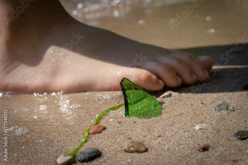 Photography Danger of broken glass on a beach