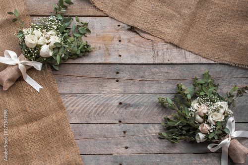 Rustic background with bouquets and burlap photo