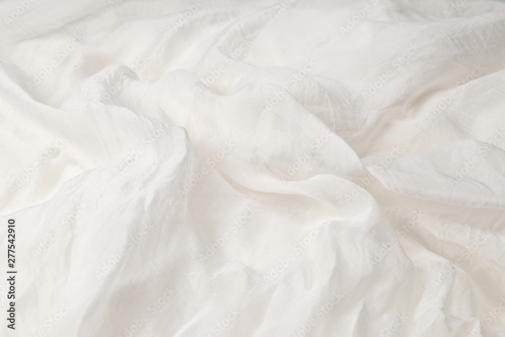 Soft smooth white silk fabric background. Fabric texture.