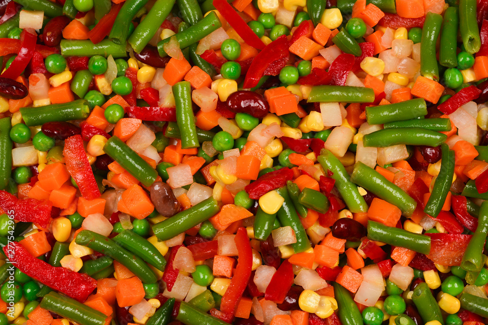 Sliced vegetables, corn, beans, peas, carrots, sweet peppers background. Sliced vegetables, corn, beans, peas, carrots, sweet peppers background.