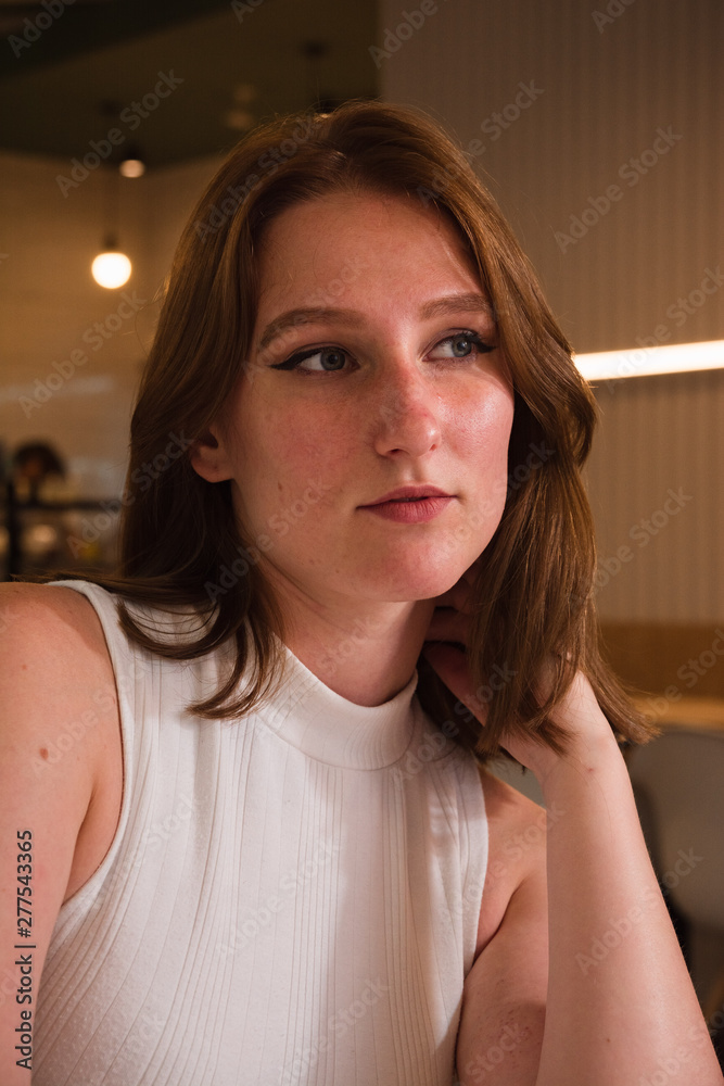 Girl is waiting for a meeting in cafe Girl is waiting for a meeting in cafe