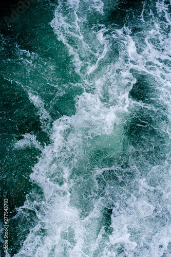 Abstract water ocean waves texture background. © Tavan