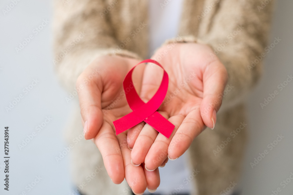 Aids Awareness. female hands holding red AIDS. Aids Awareness campaign. Aids Awareness. female hands holding red AIDS. Aids Awareness campaign.