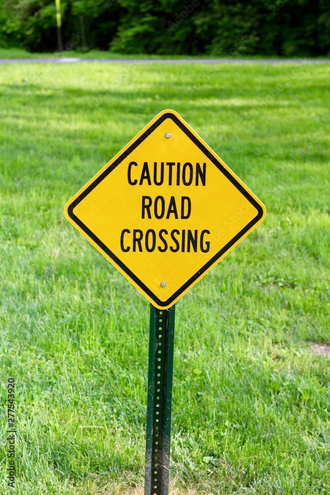 A close view of the yellow caution warning sign.