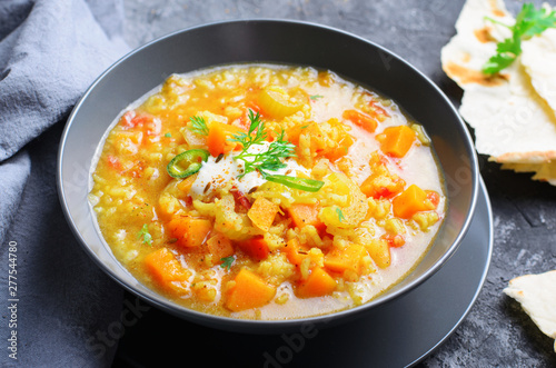Rice and Pumpkin Indian Soup on Dark Background