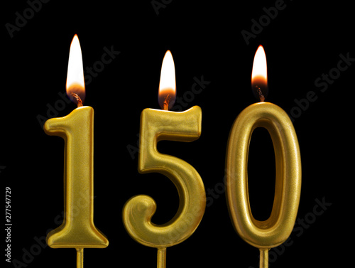golden birthday candles on black background, number 150