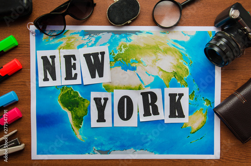New York word letters inscription wooden table top view. Preparation for the journey vacation travel concept