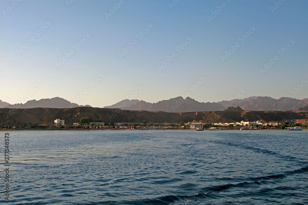Red sea coast in Sharm El Sheikh, Egypt, Sinai, view of the pier, where the excursion boats depart