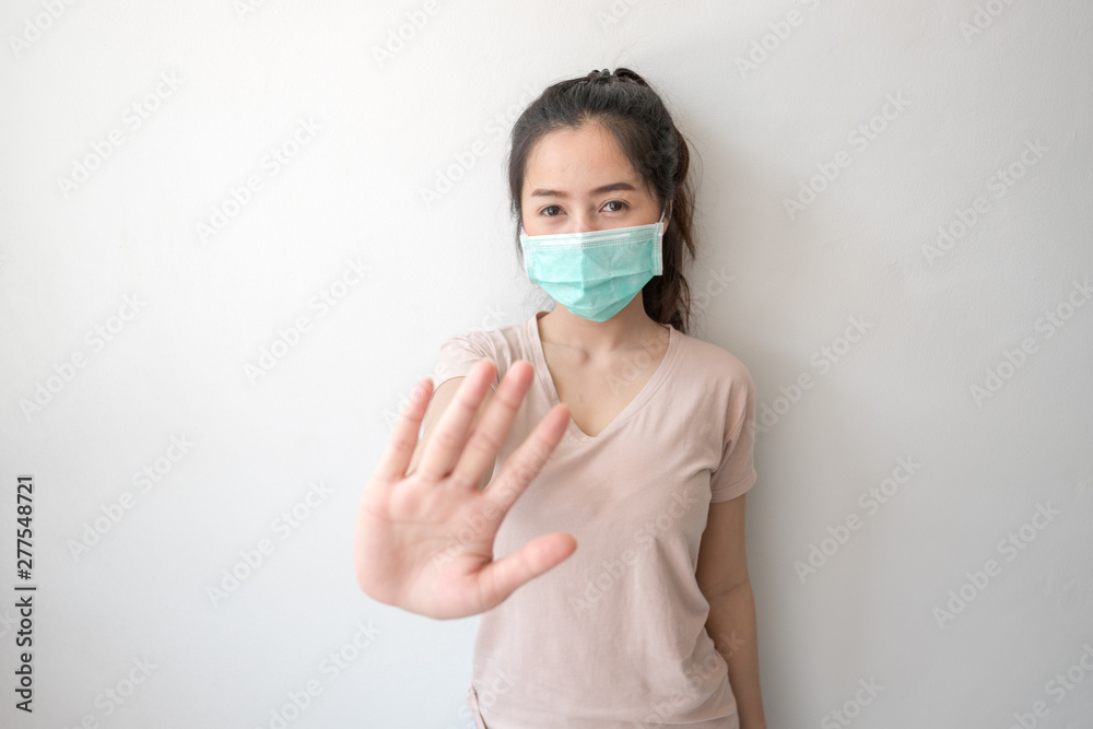 Stop the infection! Healthy woman showing gesture Stop the infection! Healthy woman showing gesture