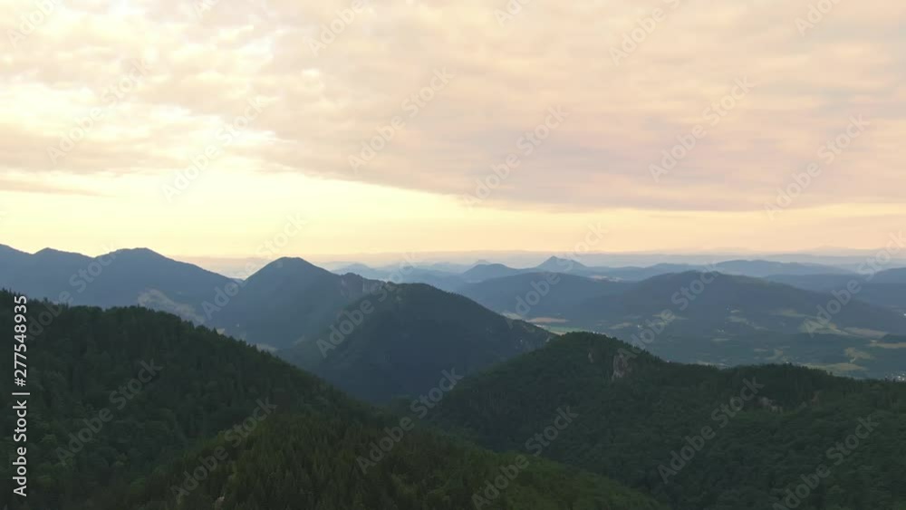 Aerial view of Mala Fatra mountains in Slovakia. Beautiful sunrise scene with look to valley and mountain in tranquil nature. Morning in the fresh forest near the hills. Vibrant colors, soft light.