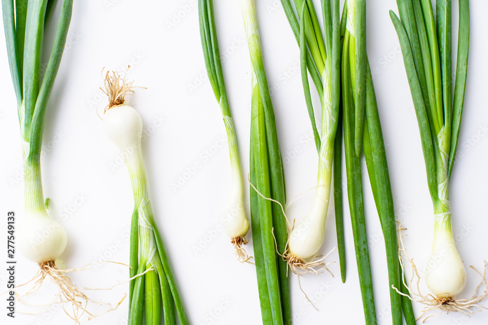 Fototapeta premium Creative layout with fresh green chives isolated on white background