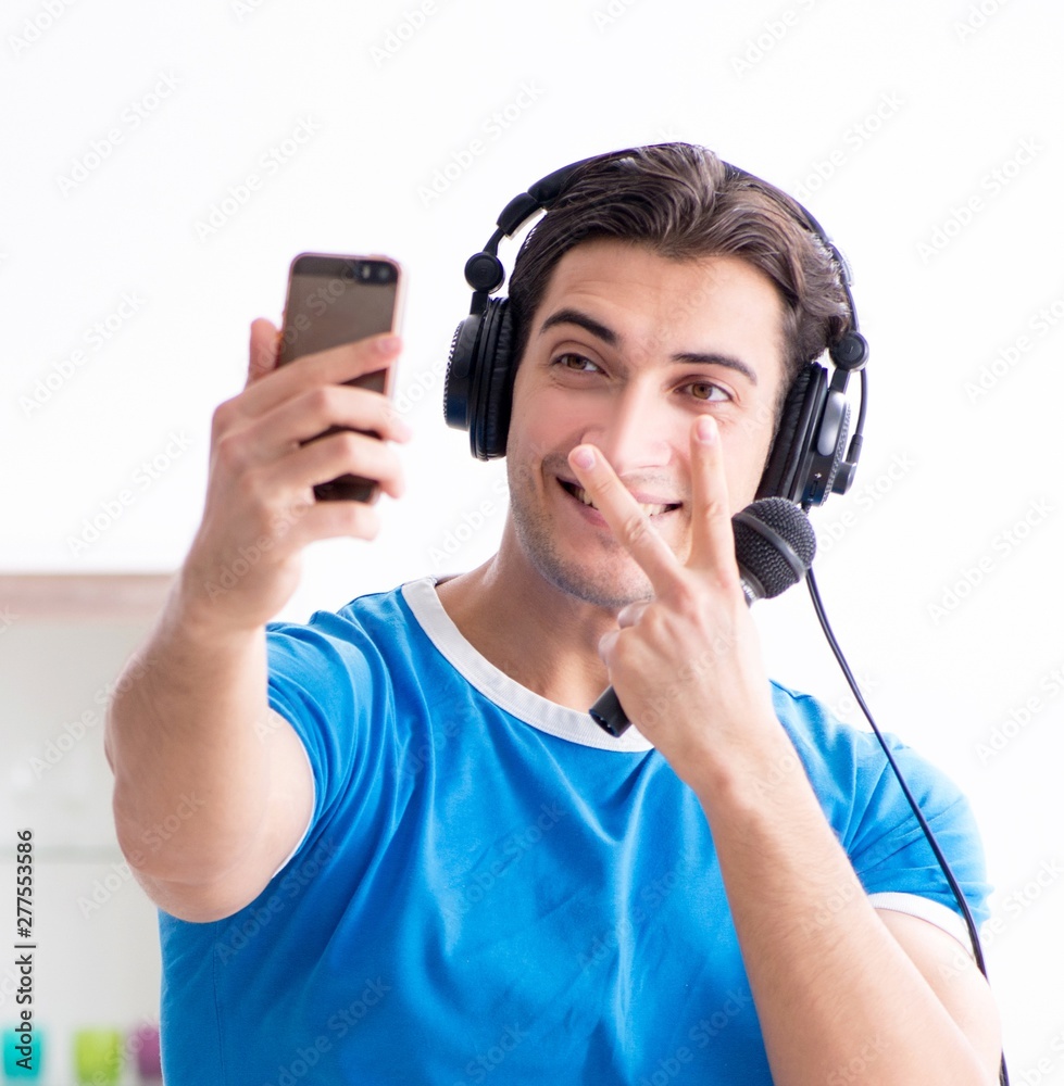 Young man singing at home karaoke Young man singing at home karaoke