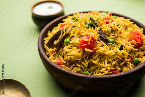 Tomato pulav/Pilaf made using basmati rice, served in a bowl. selective focus