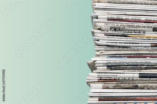 Pile of newspapers on background photo