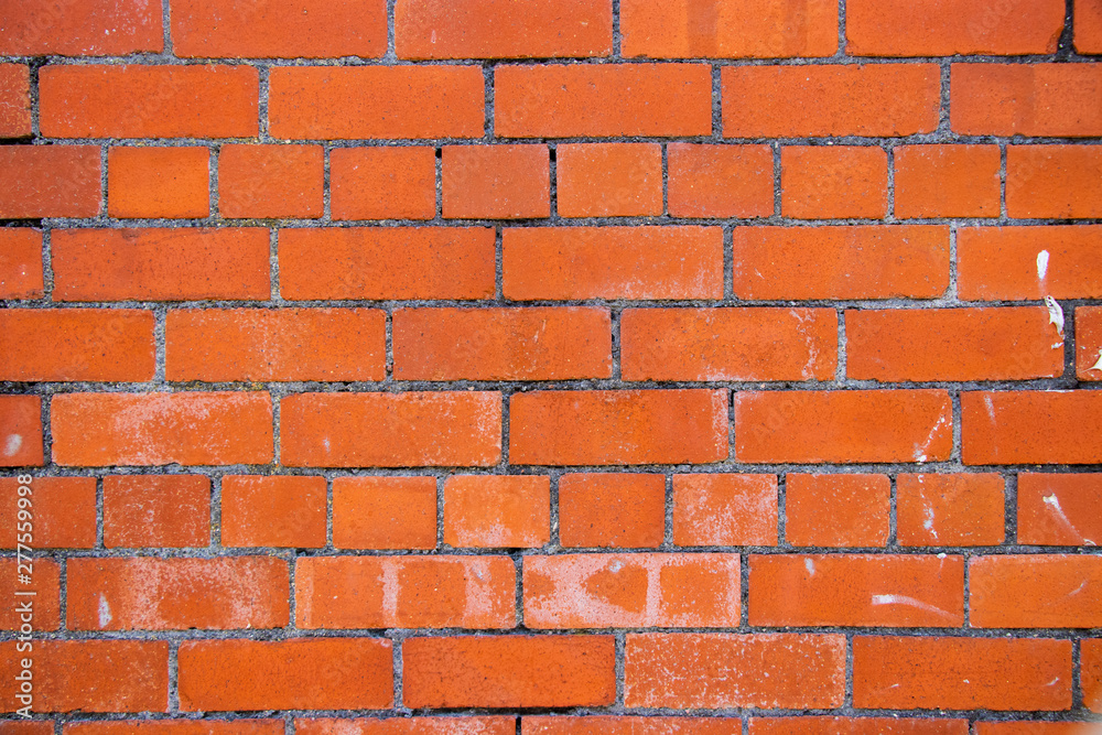 Obraz premium Orange brick wall surface background texture