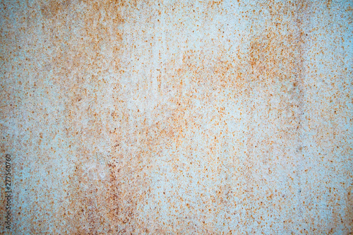 Old corroded metal wall background with flaky blue green paint .Rusty flaky cracked metal surface.Abstract the surface texture of the old metal.
