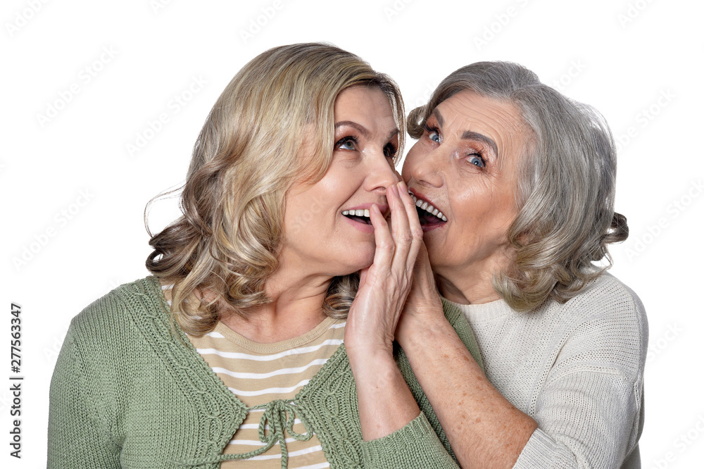 Portrait of two smiling women on white background Portrait of two smiling women on white background
