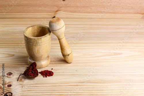 wooden mortar to grind and Annatto tree (Bixa orellana L.) of Thailand medicinal properties of the drug