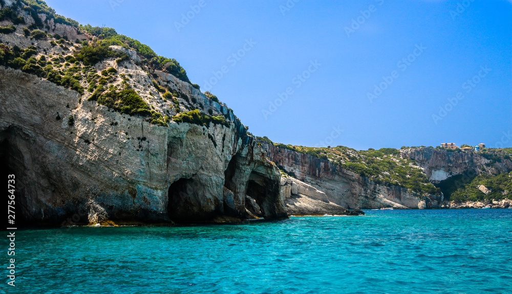 Fototapeta premium View on rocky shore of Zakynthos Island and crystal clear water of Ionian Sea.