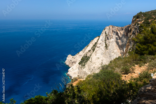Zakynthos Island, Greece. View on horizon, rocky shore and turquoise, crystal clear waters of Ionian Sea