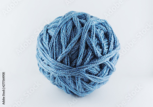 A large ball of blue wool. Cozy accessories. Materials for knitting.
