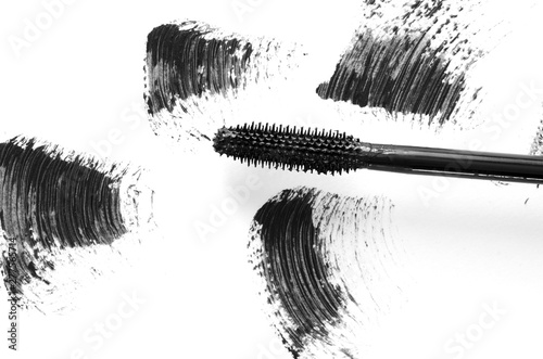 Stroke of black mascara with applicator brush close-up, isolated on white background. - Image