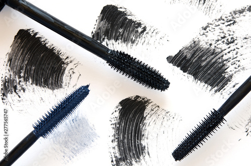 Stroke of black mascara with applicator brush close-up, isolated on white background. - Image