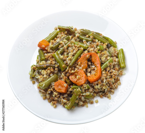 buckwheat with green beans with garlicand carrots isolated on white background. Diet breakfast on a plate.  food vegetarian top view photo