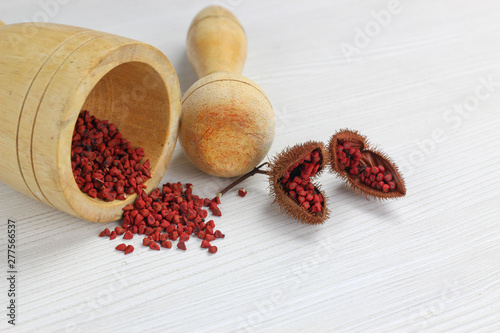 wooden mortar to grind and Annatto tree (Bixa orellana L.) of Thailand medicinal properties of the drug