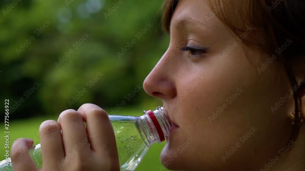 girl in nature is drinking clean water girl in nature is drinking clean water