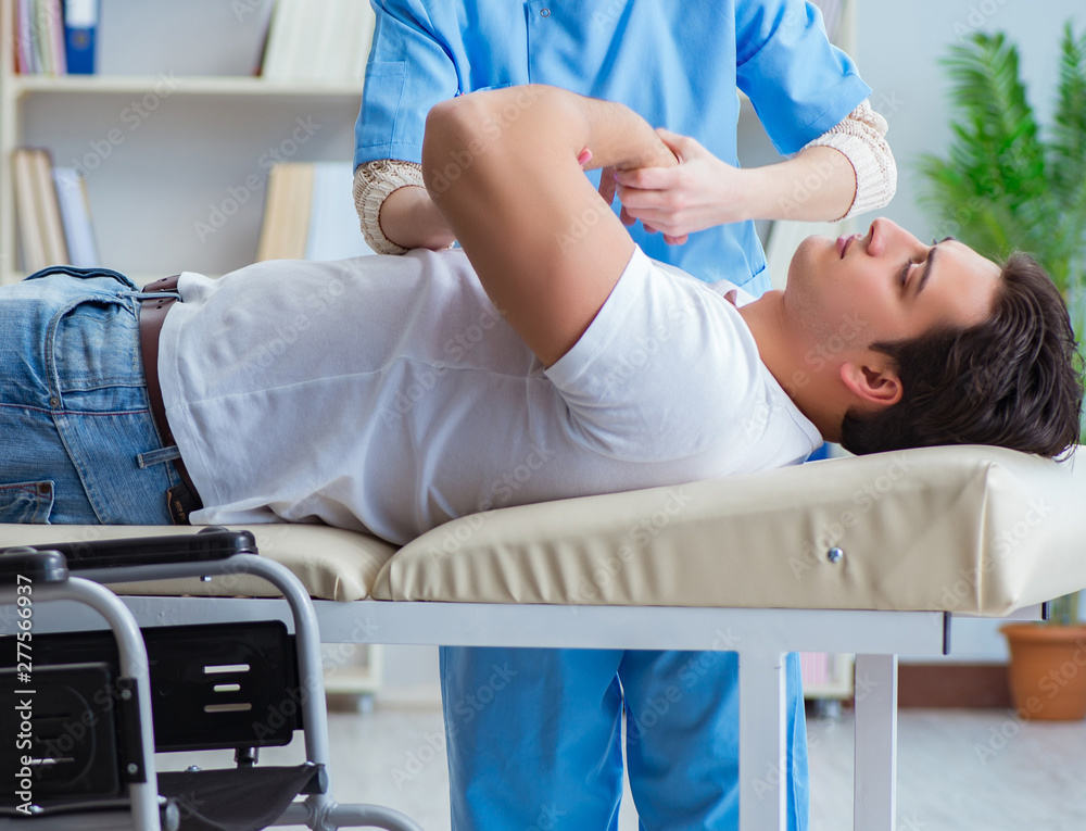 Patient undergoing rehabilitation recovery programme with doctor Patient undergoing rehabilitation recovery programme with doctor