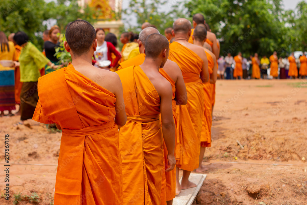 There was a merit making in the morning. People would scoop food into the alms of many monks.