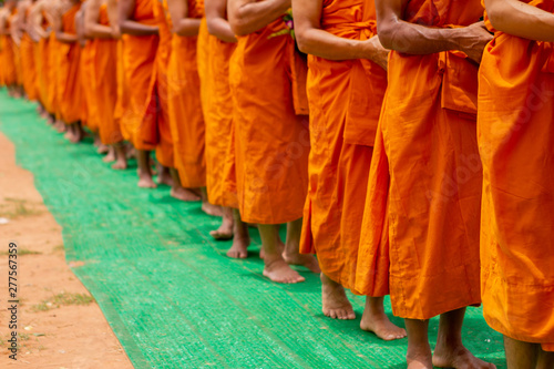 There was a merit making in the morning. People would scoop food into the alms of many monks.