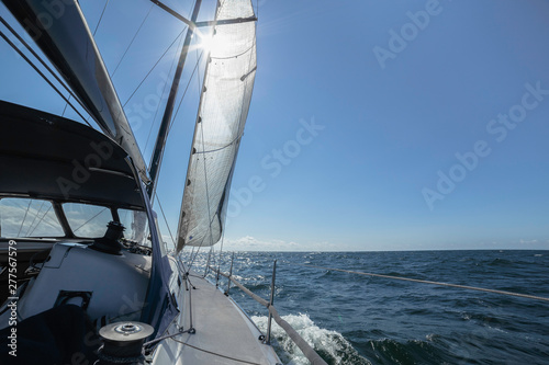 Sailing boat at open sea in sunshine © Photobes