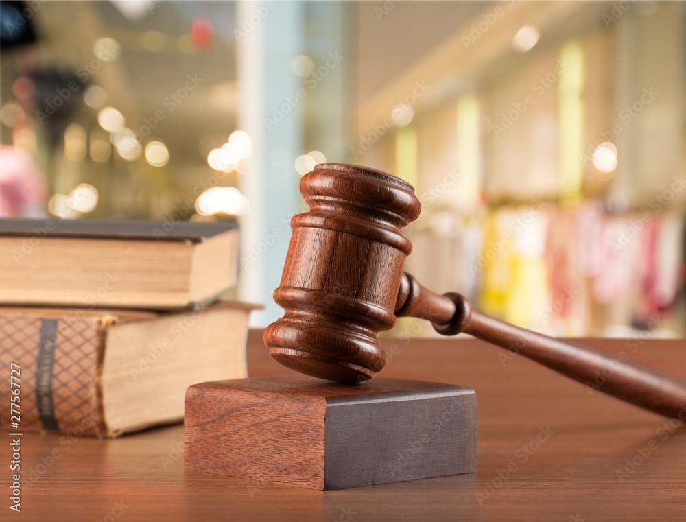 Wooden judge hammer with copyspace over background. Justice and law concept Wooden judge hammer with copyspace over background. Justice and law concept