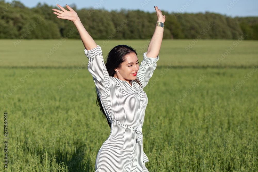 young happy girl walking in the field young happy girl walking in the field