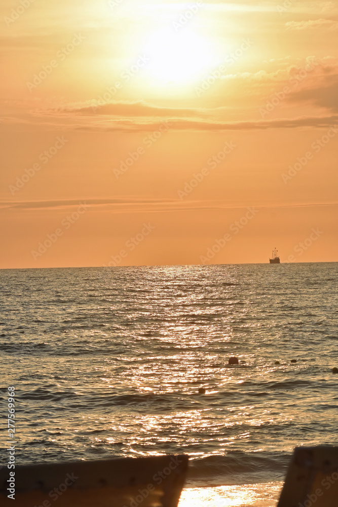 Golden Sunset at the Beach with Ship Golden Sunset at the Beach with Ship