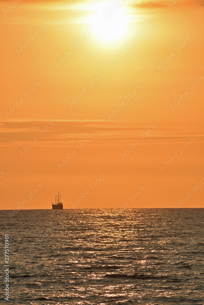 Golden Sunset at the Beach with Boat