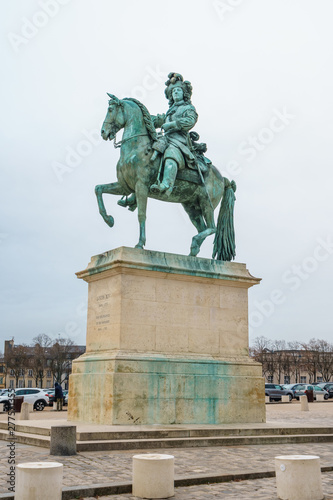 Equestrian statue of Louis XIV on Place d'Armes in front of Palace of Versailles. Palace Versailles was a royal chateau.