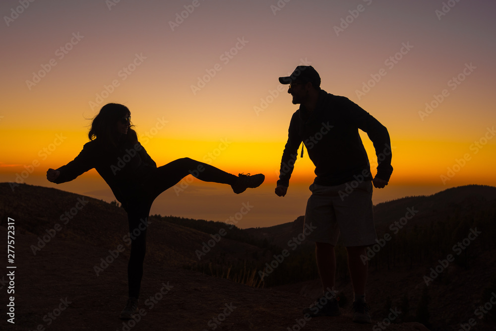 A silhouette of a couple on the top of Teide