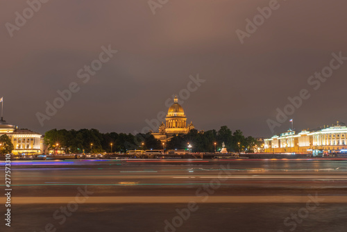 St. Isaac's Cathedral in the light of the night lights of the city overlooking the river Neva